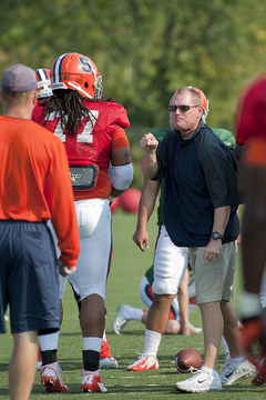 Head coach Scott Shafer yells at senior nose tackle Zian Jones for jumping offsides in practice on Tuesday. He threw his visor in frustration moments earlier.