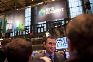 Syracuse head coach Doug Marrone stands on the floor of the New York Stock Exchange in a pre-Pinstripe Bowl event. Marrone's name has been thrown around as a candidate for multiple NFL head coaching jobs.