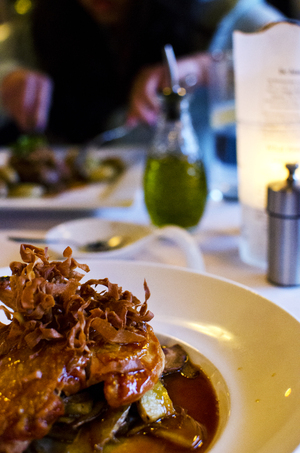 The roasted half chicken at BC Restaurant featured duck confit,parsnips and thinly sliced potatoes