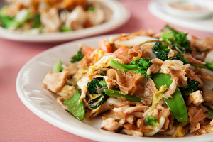 Erawan’s Thai Restraunt’s spicy pad ki mao with chicken is comprised of large rice noodles fried with egg, oyster sauce, tomato, onion, sweet basil leaves, chili peppers, snow peas, Napa cabbage and broccoli. Many of the dishes served at Erawan Thai Restaurant had overwhelming flavors, which made some of them hard to finish.