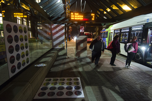 Cuse-ster is modeled after Twister, but instead of solid dots, the spots on the Cuse-ster board feature silhouettes of important buildings in proximity to the bus stop where the game is being played.