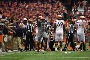 De'Jon Wilson comes out of a pile with a Virginia Tech fumble. His performance was part of Syracuse's defensive dominance against the Hokies. 