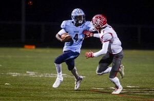 Kwaszi Gaddis runs by a defender.