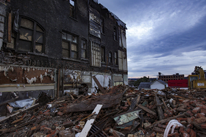 Four historic buildings on the 700 block of North Salina Street were destroyed after a discarded cigarette started a massive fire.