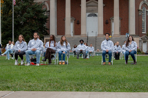 Each of the scholars sat in chairs corresponding with the seat numbers of their respective victim on the flight 34 years prior.