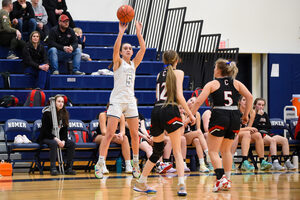 Catherine Apker excels on the basketball court, becoming her high school's all-time leading scorer 