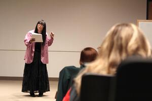 Ryka Aoki, writer, performer and educator, addresses the audience in Watson Theater on Transgender Day of Liberation.