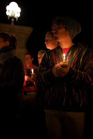 Tom Badman, a sophomore physics and art dual major, listens as the names of the 35 Syracuse University students killed in the Pan Am Flight 103 bombing are read.