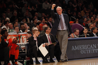 Head coach Jim Boeheim cheers from the sidelines as Syracuse holds off Georgetown into the second half.