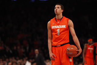 Michael Carter-Williams pauses before taking a free throw.