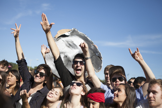 Crowd members jam out to Robert Delong.