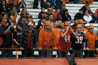 Syracuse fans yell to the field.