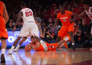 Syracuse's Michael Gbinije recovers a loose ball.