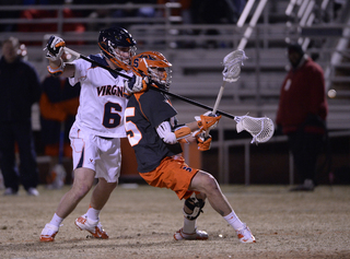 Syracuse attack Randy Staats works against Virginia defender Tanner Scales. 