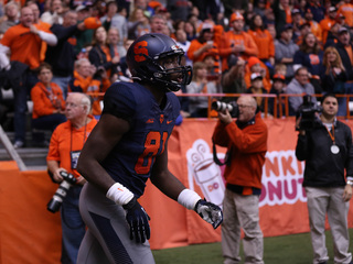 Freshman tight end Jamal Custis runs out of the tunnel at the start of the game.  Custis was an end-zone target in the first half, but he couldn't make a catch. 