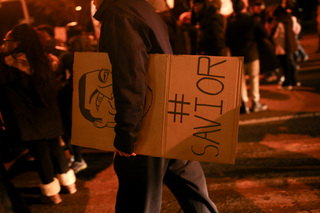 A marcher cradles a 