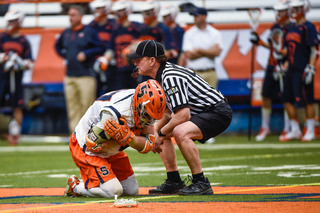 WIlliams crouches at midfield after suffering a shoulder injury. 