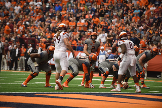 Eric Dungey stands behind his offensive line before taking a snap. Dungey was sacked just once, four fewer times than he was sacked last week.