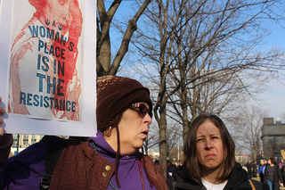 Annette Labarge holds a sign that reads 