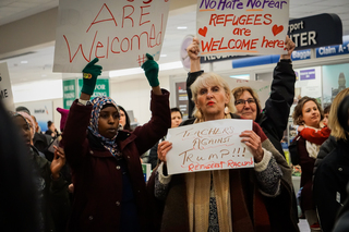 Teacher Joyce Suslovic stands in solidarity with teachers and students affected by the executive order.