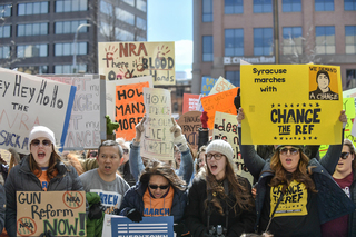 Dozens of protesters gathered outside the federal building.