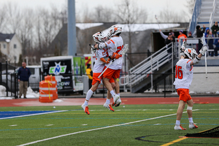 Stephen Rehfuss (29) leaps with David Lipka. 