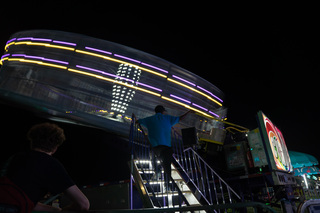 Fairgoers ride on Cyclone, which spins participants around in circles.