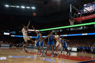 Freshman forward Chris Bell shoots over the heads of the Duke defense towards the hoop. Bell was part of Jim Boeheim’s starting lineup, but only ended up playing 11 minutes of game time. 